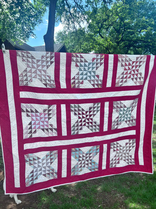 Complex  variation of the Feathered Star quilt with a bold red and the tiniest hand quilting stitches Antique quilt