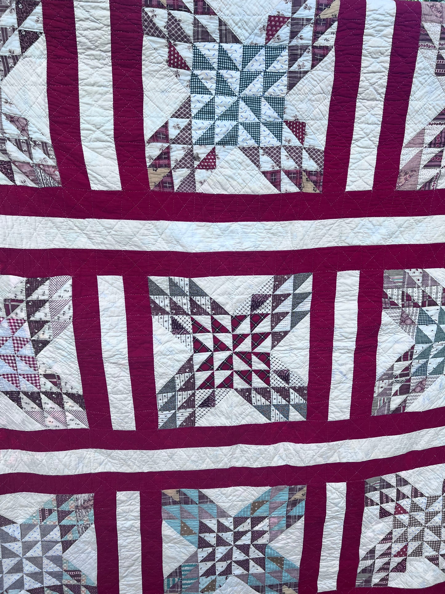 Complex  variation of the Feathered Star quilt with a bold red and the tiniest hand quilting stitches Antique quilt