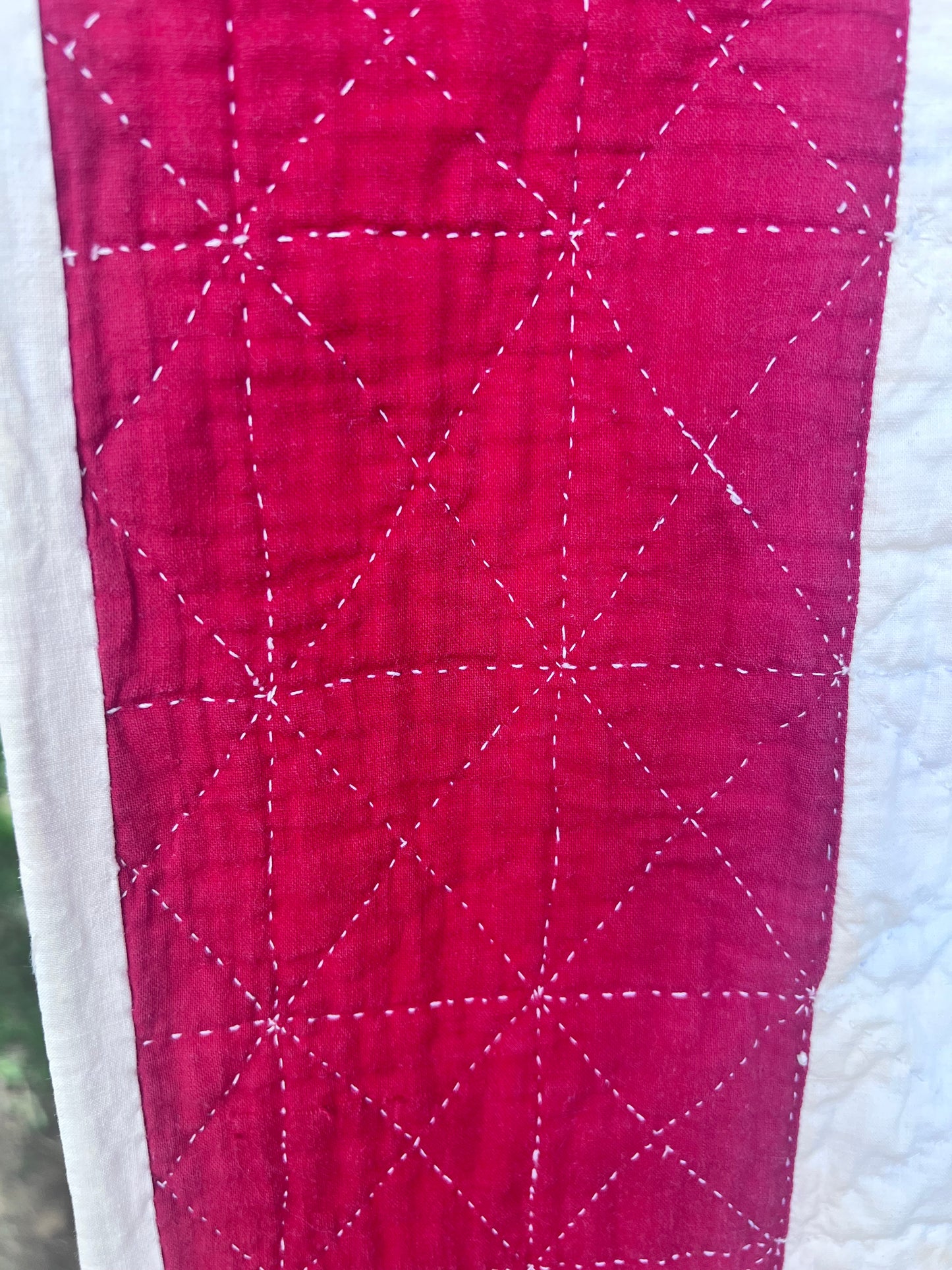 Complex  variation of the Feathered Star quilt with a bold red and the tiniest hand quilting stitches Antique quilt