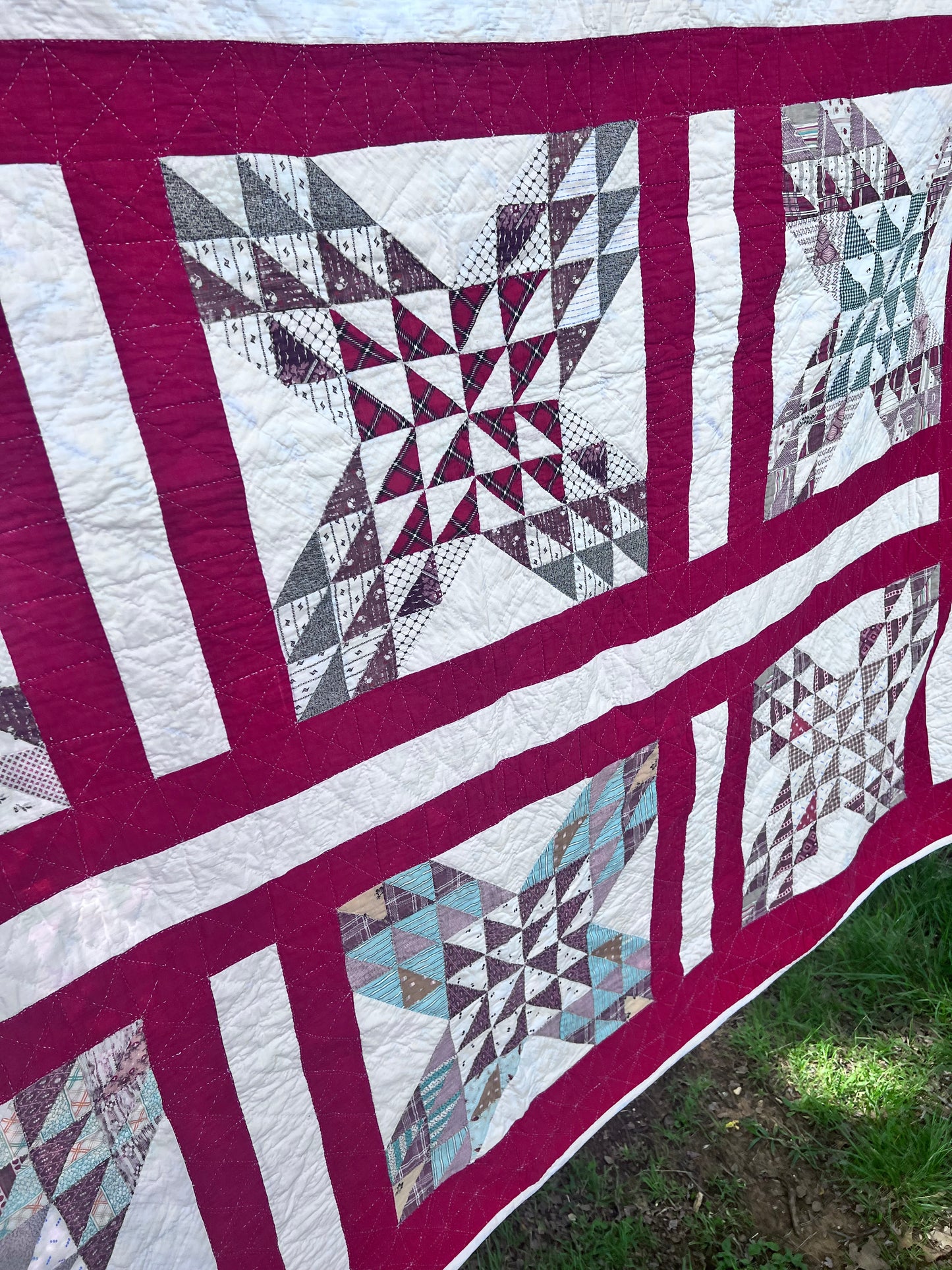 Complex  variation of the Feathered Star quilt with a bold red and the tiniest hand quilting stitches Antique quilt