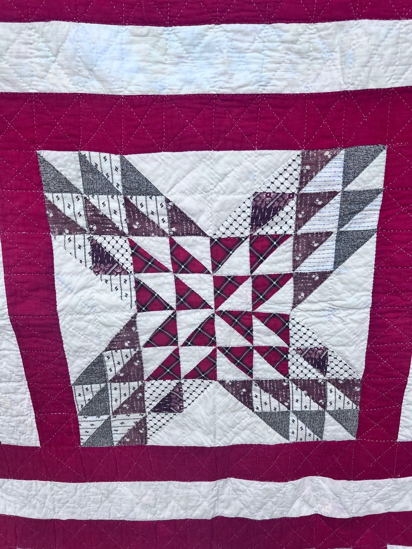 Complex  variation of the Feathered Star quilt with a bold red and the tiniest hand quilting stitches Antique quilt