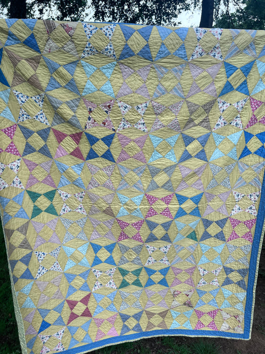 A variation of a Kaleidoscope or Star Puzzle Antique quilt in the most glorious pastels.