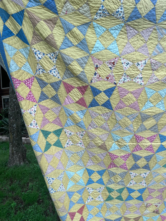 A variation of a Kaleidoscope or Star Puzzle Antique quilt in the most glorious pastels.