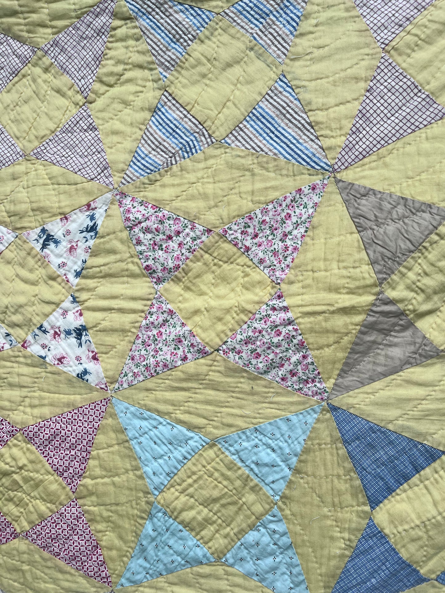 A variation of a Kaleidoscope or Star Puzzle Antique quilt in the most glorious pastels.