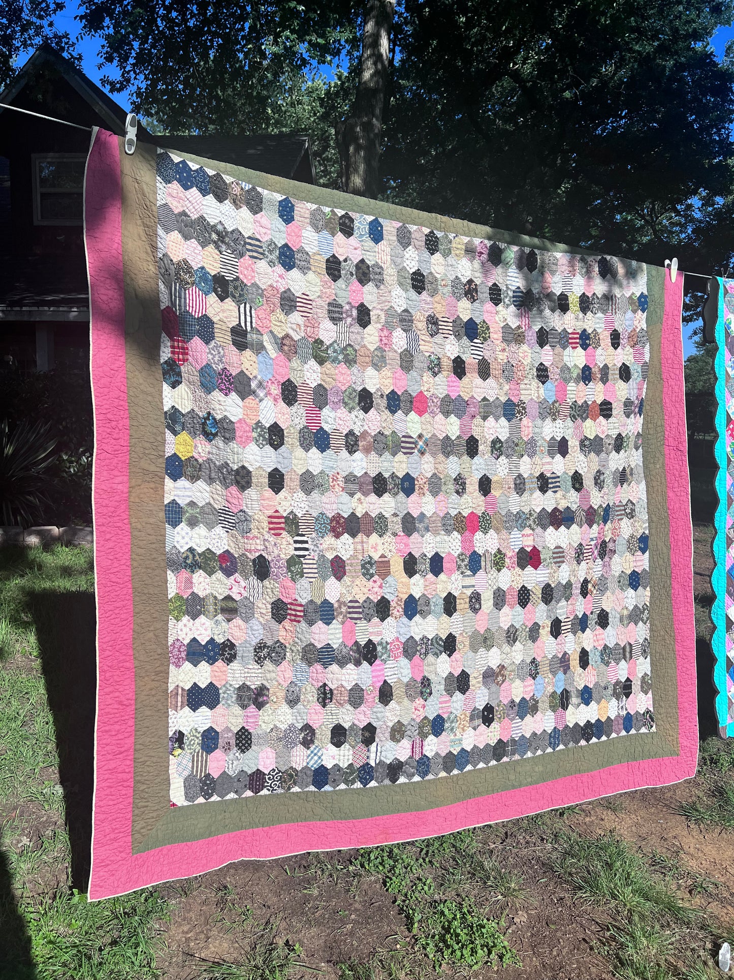 Hexagon pattern, often referred to in quilting as Grandmother’s Flower Garden when arranged in floral clusters, or simply a Hexie quilt.