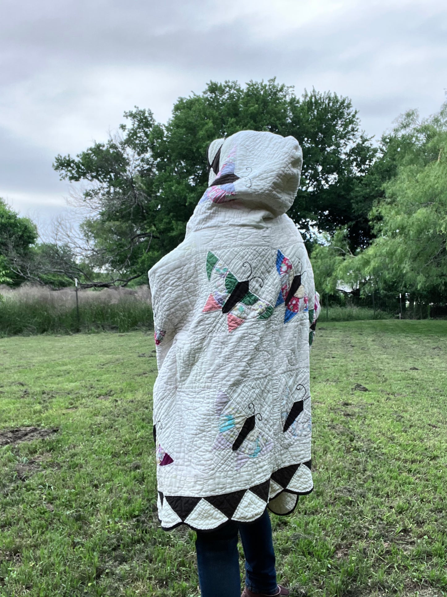 Glorious butterfly quilt made into a beautiful wrap/poncho look. One size fits all.