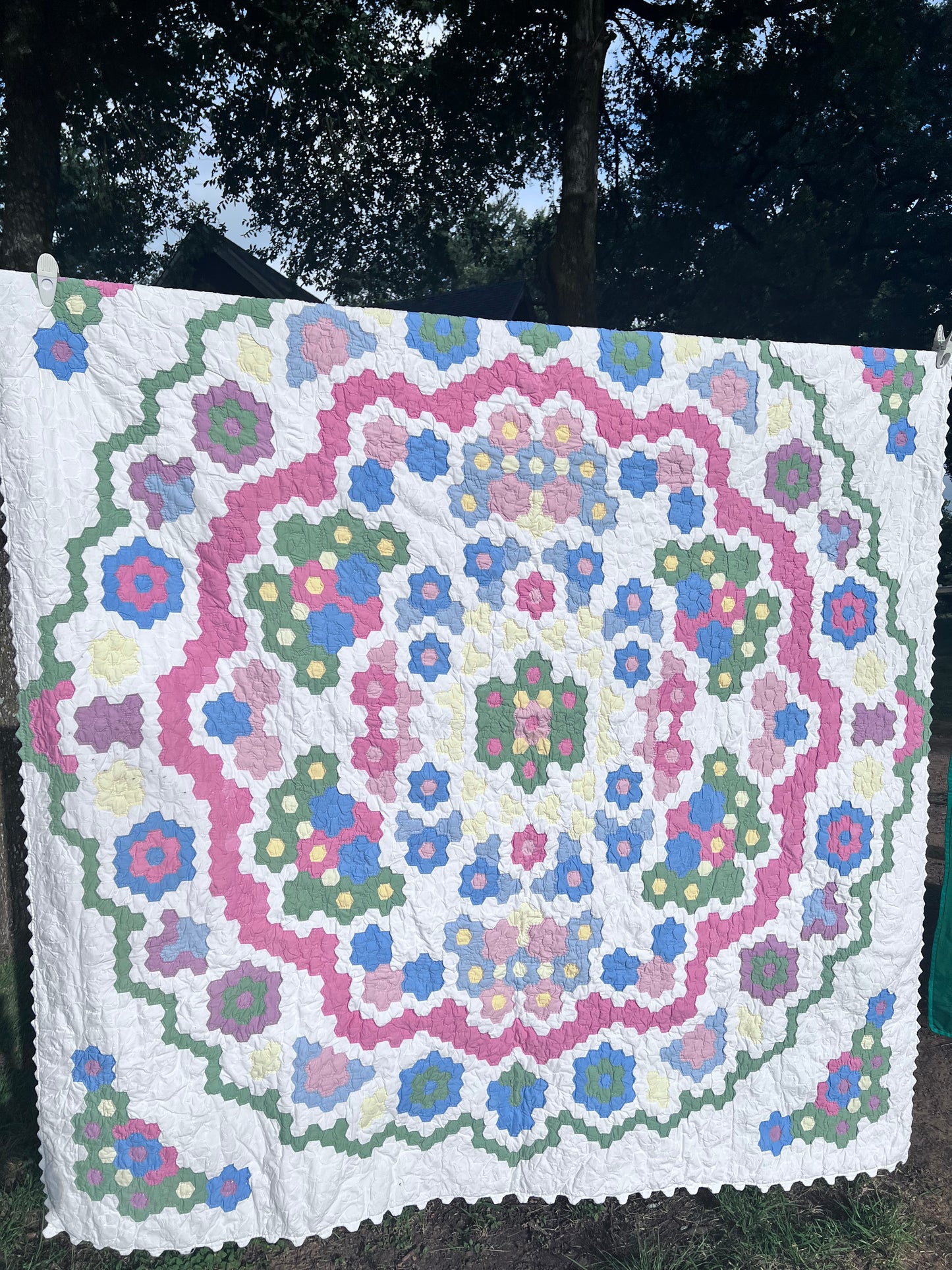 Tiny Hexi blocks creating a Grandmother's Flower Garden Style Vintage Quilt