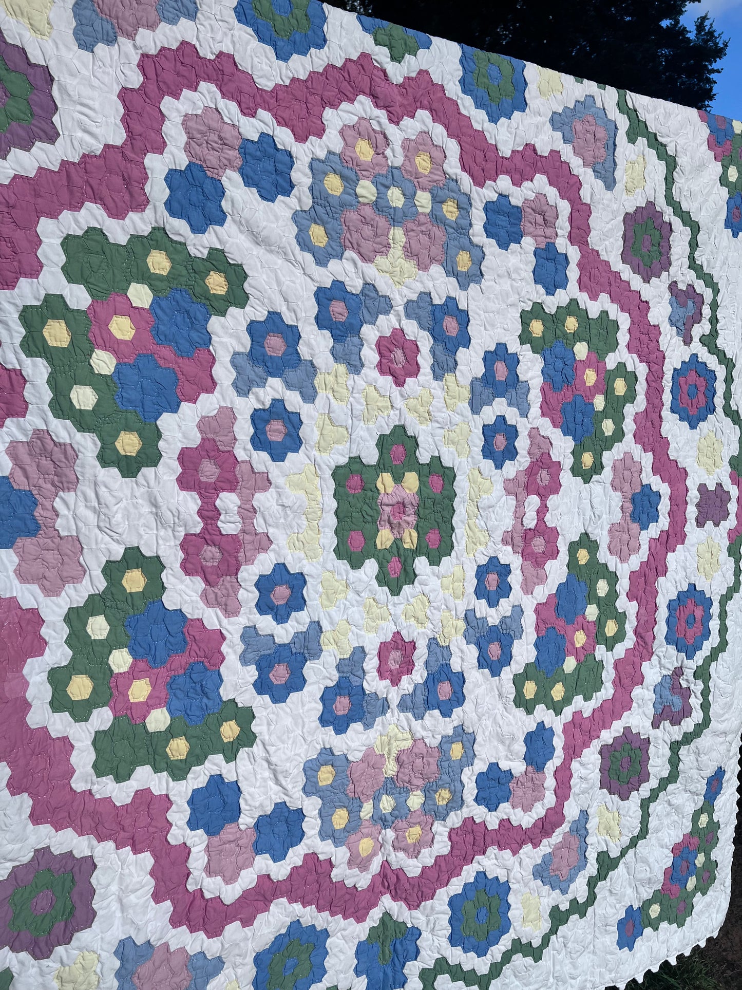 Tiny Hexi blocks creating a Grandmother's Flower Garden Style Vintage Quilt