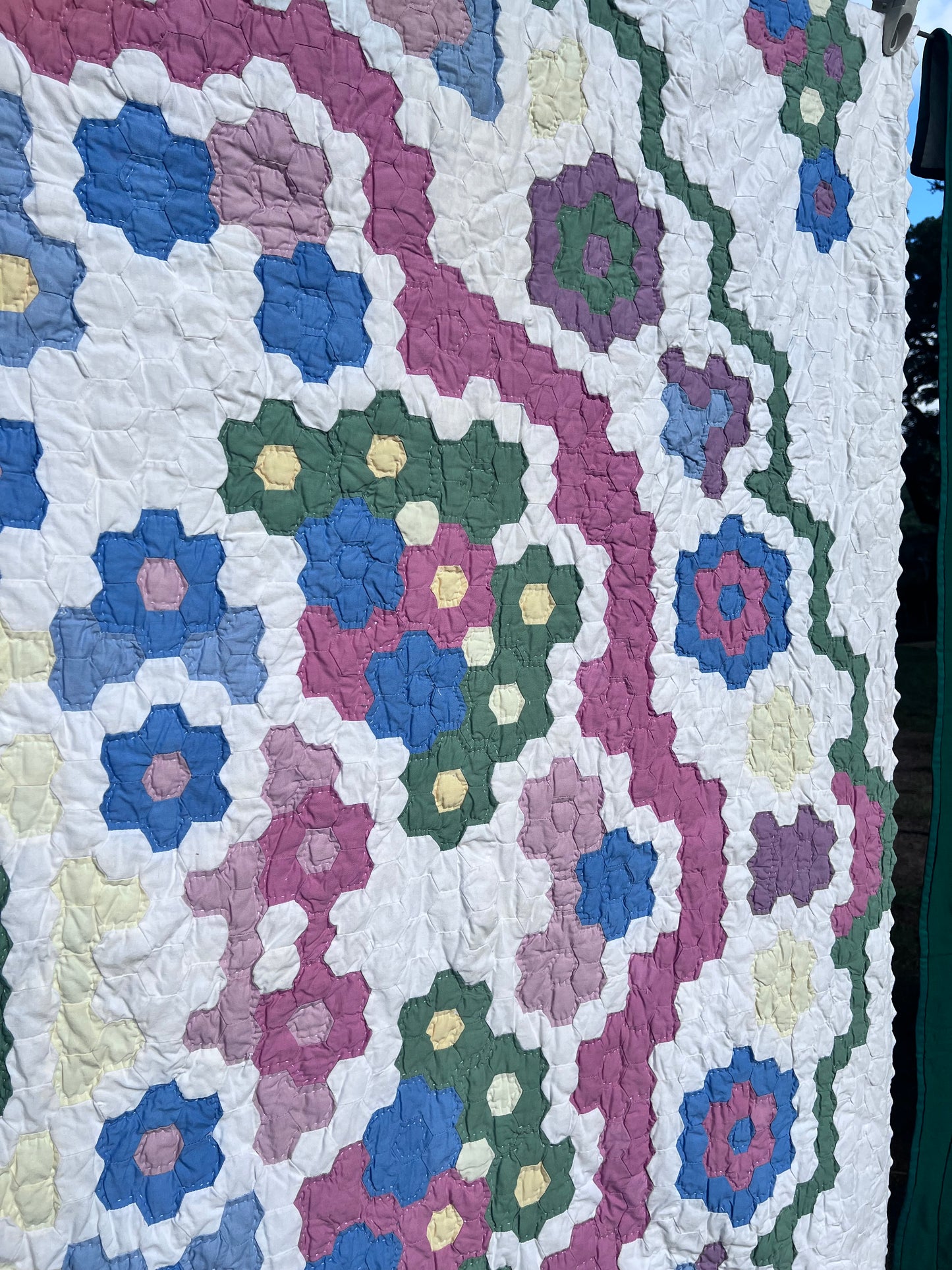 Tiny Hexi blocks creating a Grandmother's Flower Garden Style Vintage Quilt