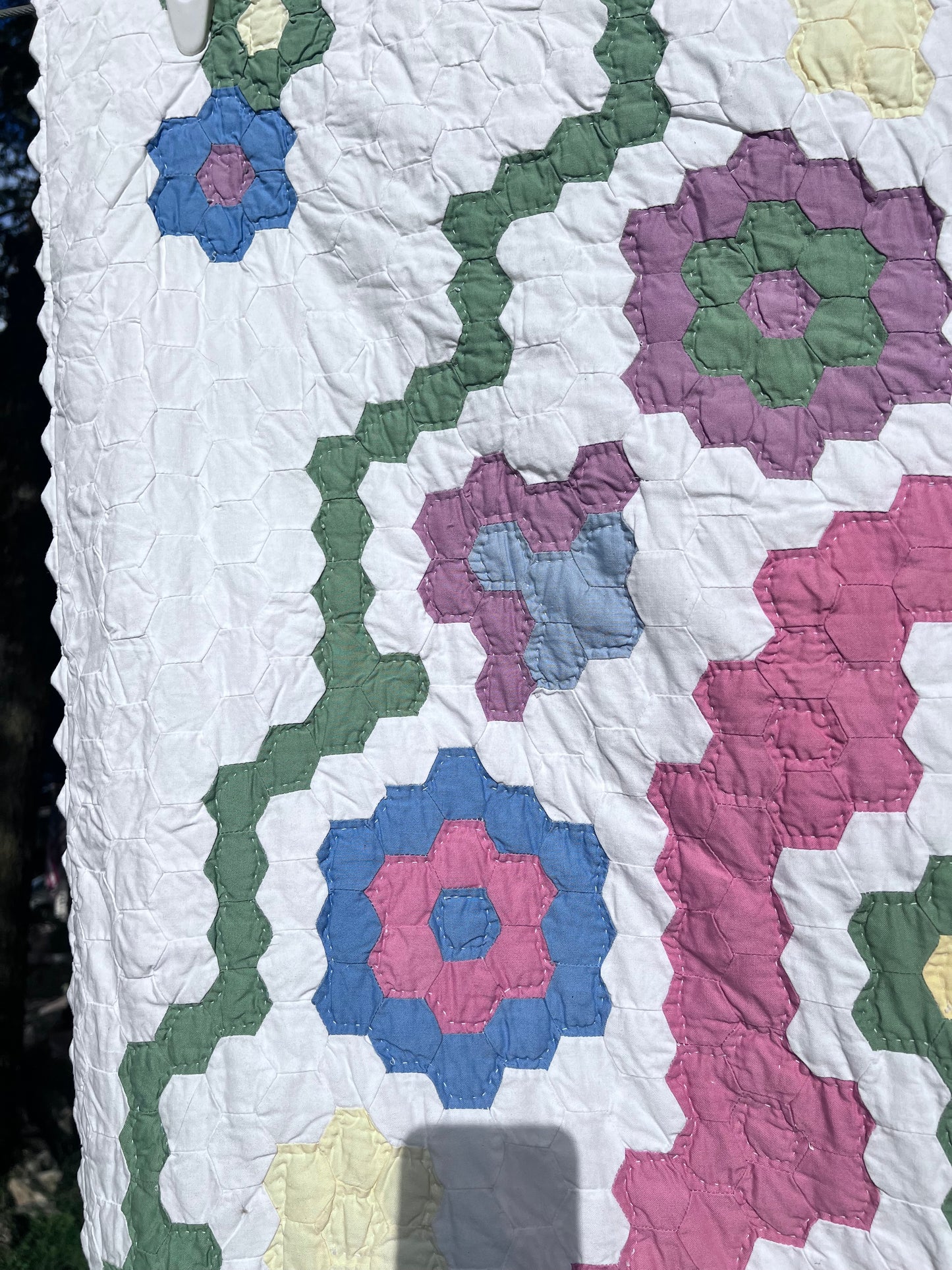 Tiny Hexi blocks creating a Grandmother's Flower Garden Style Vintage Quilt