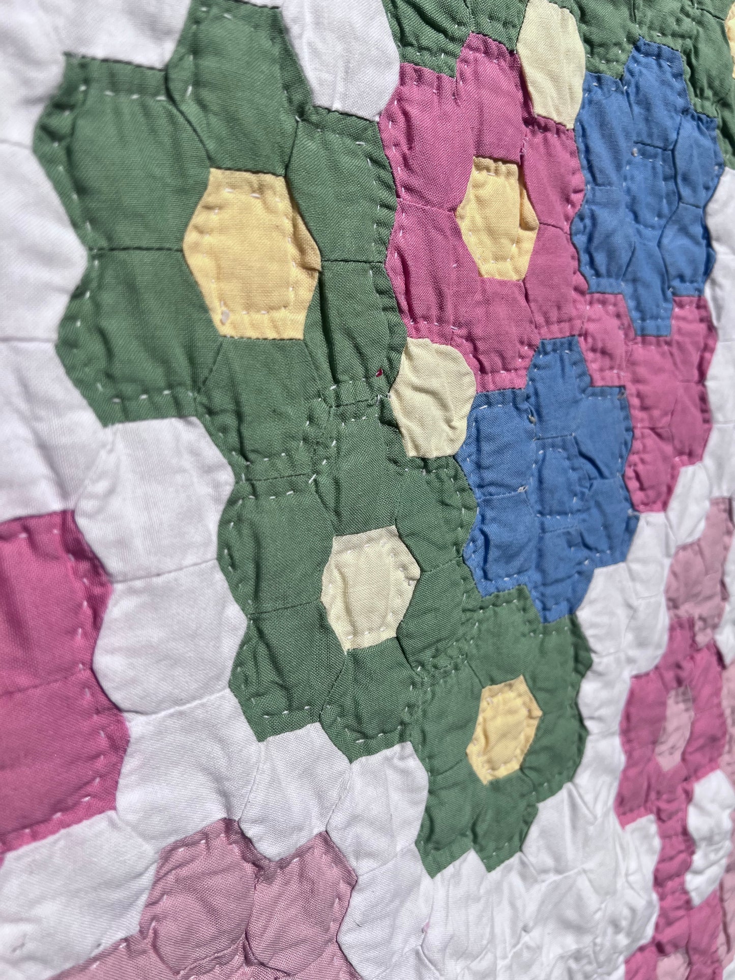 Tiny Hexi blocks creating a Grandmother's Flower Garden Style Vintage Quilt