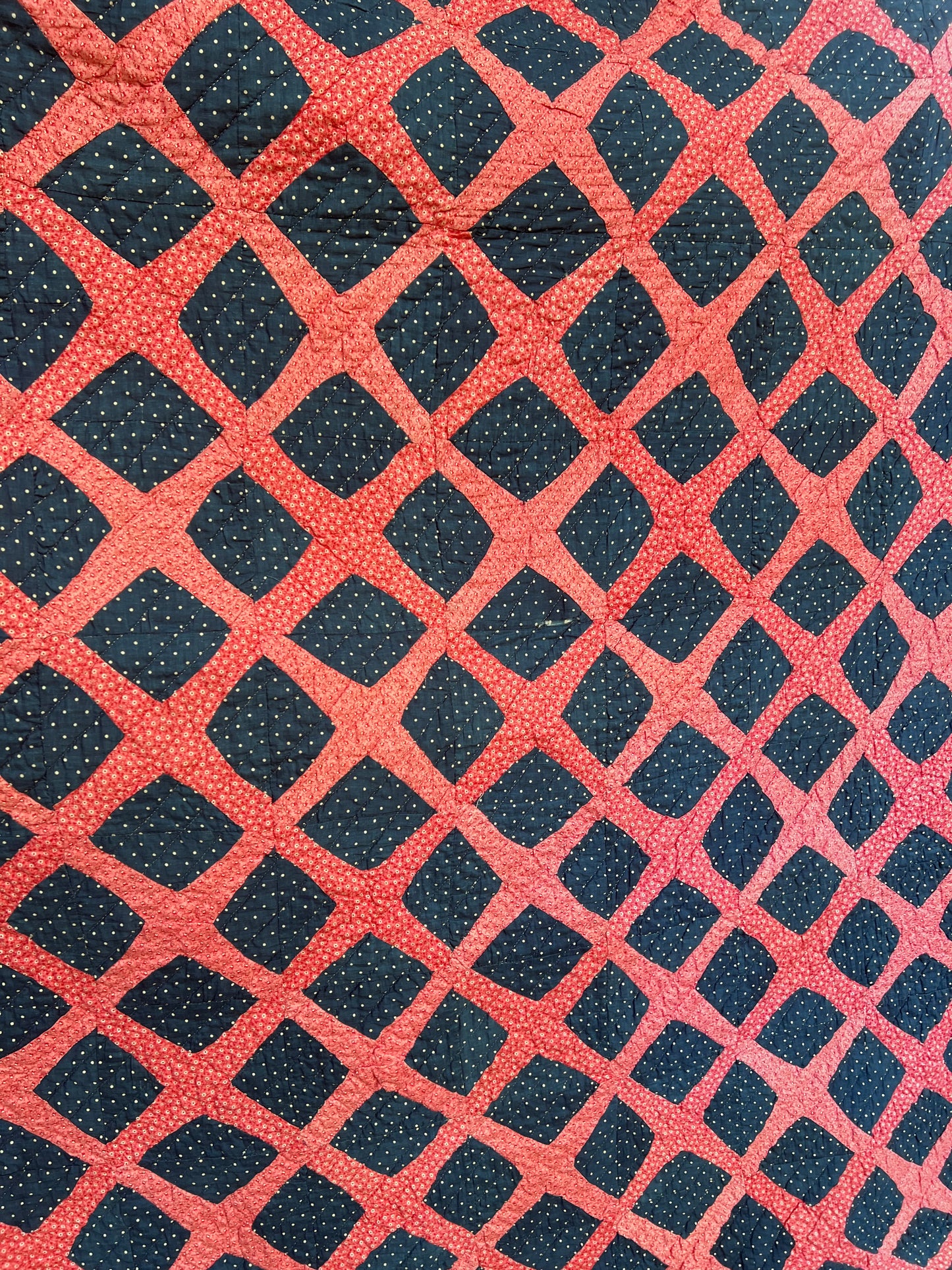Graphic vintage quilt featuring a classic traditional pattern known as the Burgoyne Surrounded, Lattice, Trellis