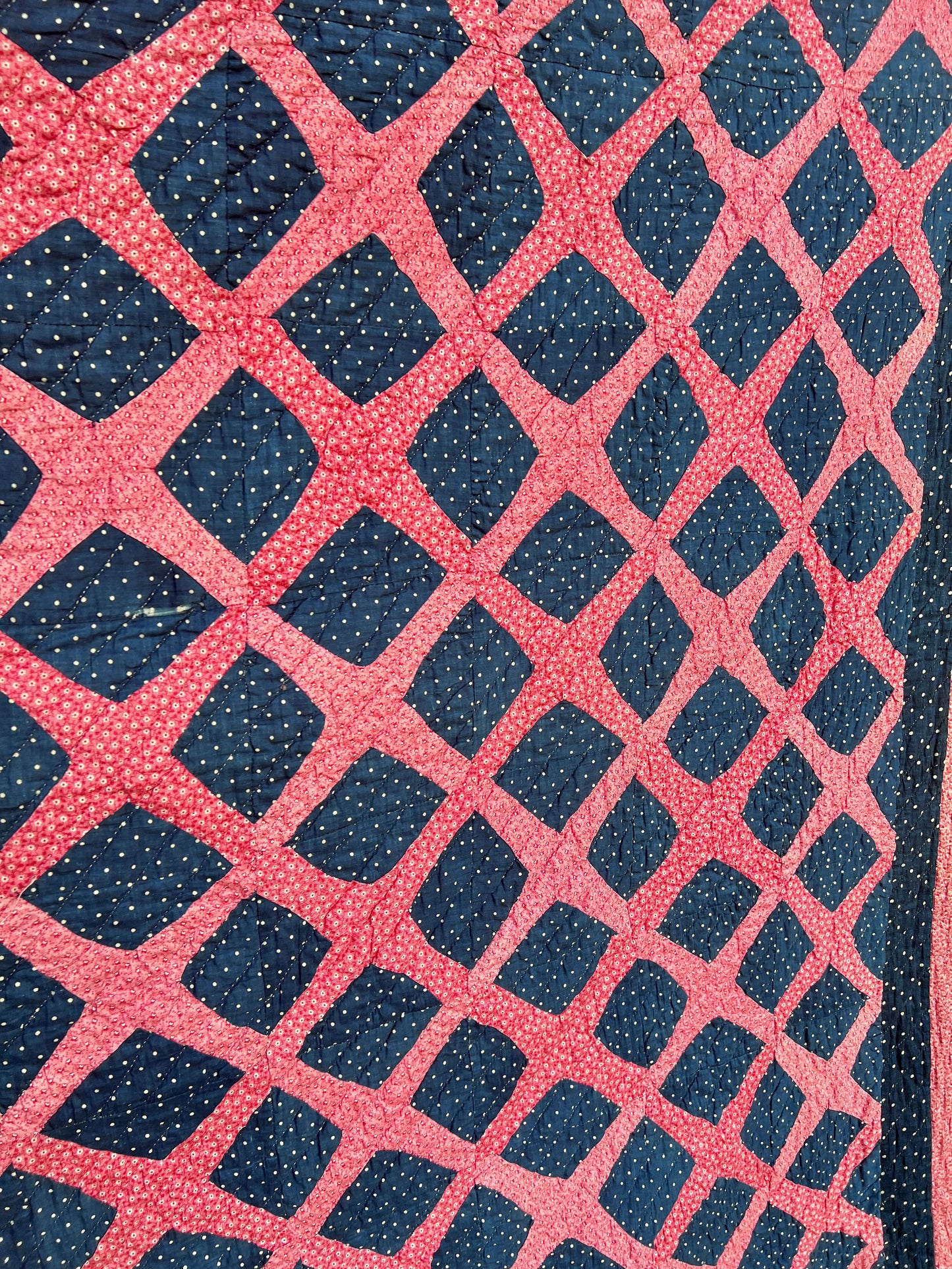 Graphic vintage quilt featuring a classic traditional pattern known as the Burgoyne Surrounded, Lattice, Trellis